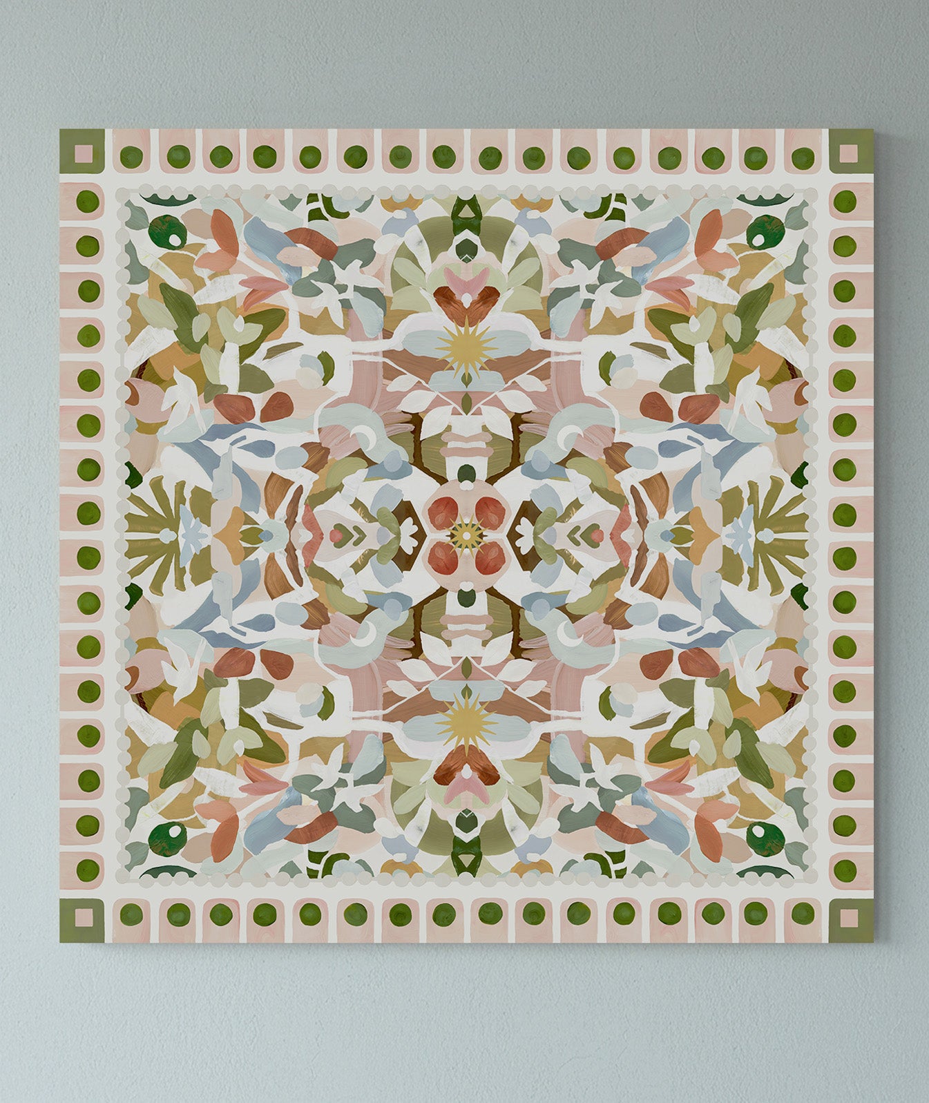 Decorative wall art with a geometric symmetrical floral pattern on a light blue gray background