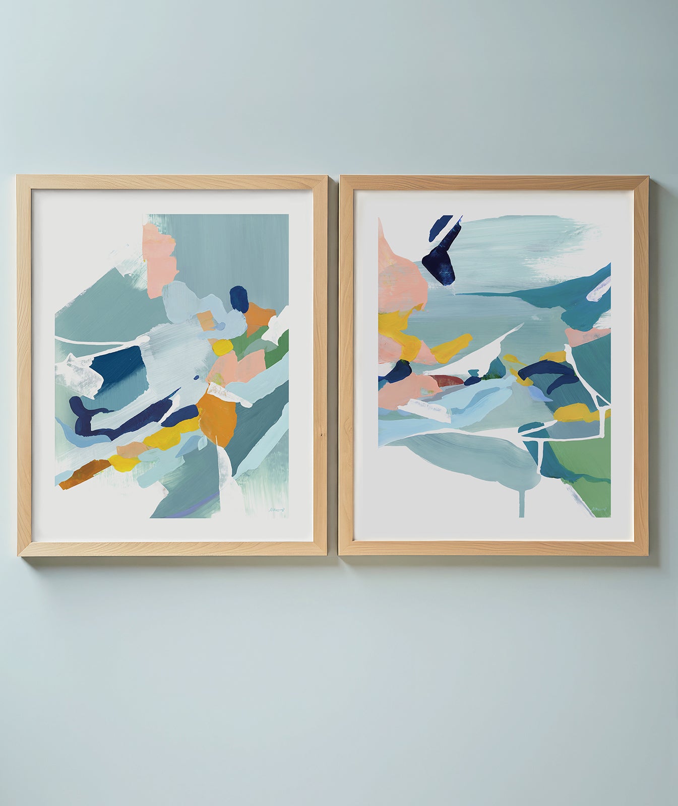 Abstract diptych ocean beach art in blues, pinks, yellows and turquoise.