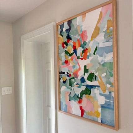 Positano abstract art painting in a wooden frame on a white wall