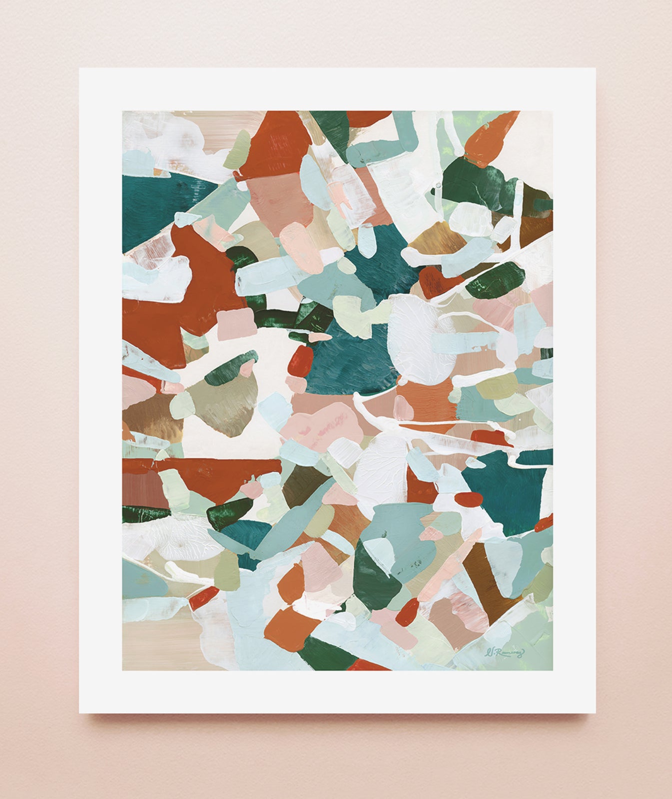 An abstract art print with a white border in warm browns, sage greens, blues and turquoise colors displayed on a solid background.
