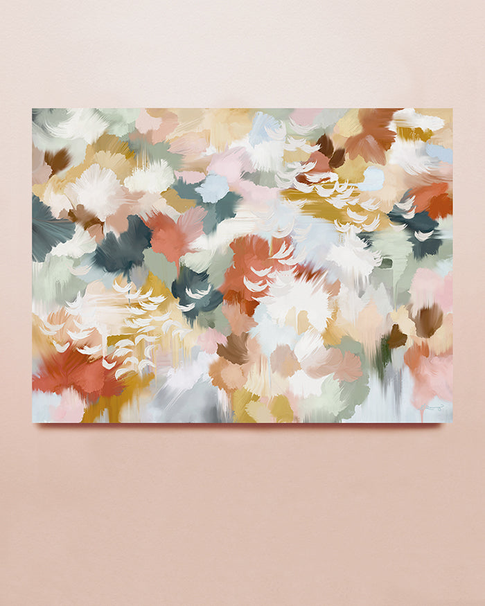 An abstract art print in red, turquoise, yellow, beige and sage displayed on a solid background.