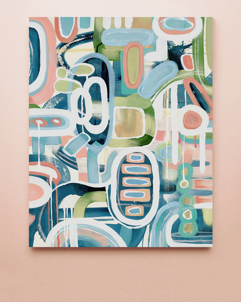An abstract art print with pink, green and blue colors displayed against a solid background.